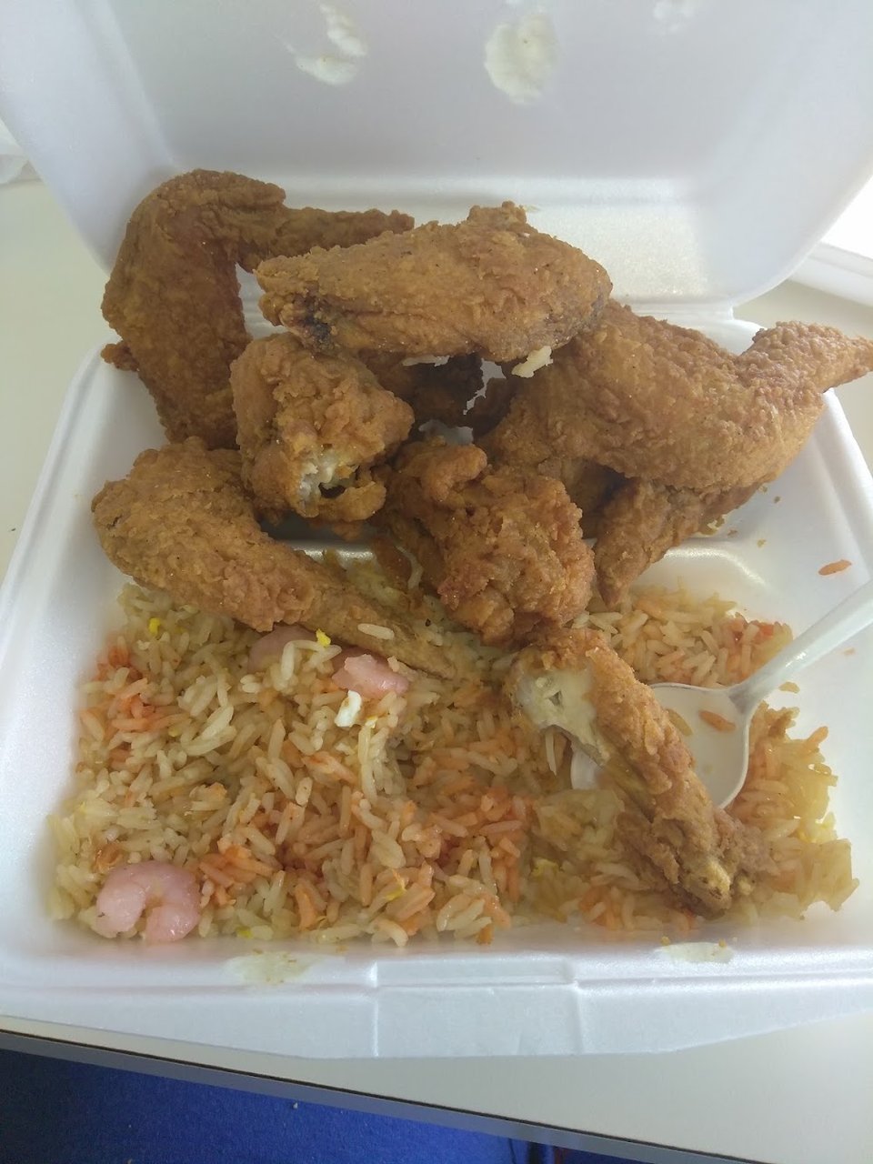 Printed menu with shrimp fried rice.